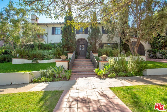 10470 Charing Cross Road Los Angeles, California Gorgeous Spanish Revival located in charming Little Holmby, featuring a remodeled chef's kitchen with all new appliances and hardwood floors throughout. This house is ideal for entertaining and creating memories. The traditional downstairs features a classic living room with high beamed ceilings and wood burning fireplace, family room with bar, separate dining room, cozy study with an additional wood burning fireplace and converted California basement into wine cellar. With all 4 bedrooms upstairs, these elegant family home, recently updated, is in move-in condition. The beautifully landscaped, expansive, flat back yard also features two entertaining patios, grass area, a large pool, spa, pool house, gym and bathroom which can easily be converted to extra living space.