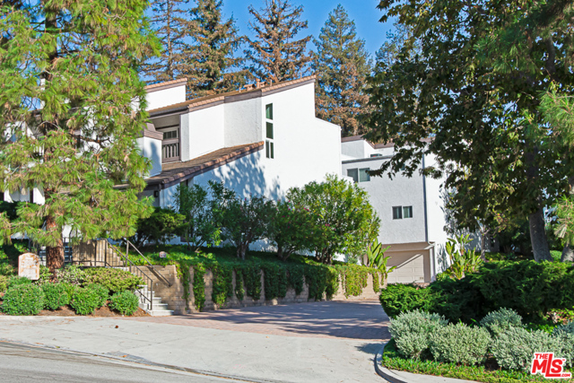 1538 Palisades Drive Pacific Palisades, California Nestled in the magical canyons of the Palisades Highlands! Tranquil living abounds in this beautiful 3 bedroom, 3 bath townhome with hardwood floors, stainless steel appliances, granite counters, newer cabinetry, and mountain views. Desirable floor plan with all three bedrooms on the upper floor with large en-suite master. Private enclosed patio and balcony off master with treetop views. Two car direct access garage with electric charger and large storage area attached. Resort amenities include a heated pool, spa, tennis, fitness center, and 24-hour security, along with membership to Palisades Drive Recreation Association that includes a private playground and dog park. Short distance to Casa Nostra restaurant and short drive to hiking, beach, and the Palisades Village mall. Where coming home feels like a getaway!