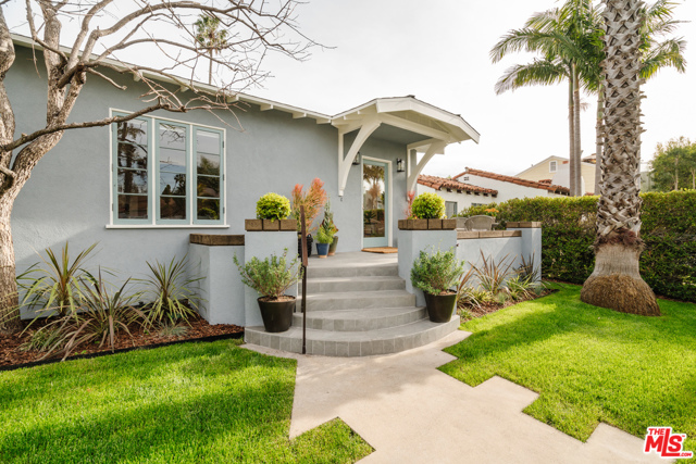 824 Crestmoore Place Venice, California Adored and restored by TV reality star Ty Pennington, this cheerful Venice home exudes creativity and style. Tucked away on a one-way street near the beach, Venice Boardwalk, canals & Abbot Kinney's hot spots, the original 1927 dwelling was updated this year and is highlighted by special touches throughout, including bamboo flooring, baths adorned in vintage-inspired ceramic tile, a master bath sporting a standalone shower and an antique cast-iron freestanding tub, kitchen with concrete countertops and wraparound, porcelain-tiled porch. This 2,102 SF home features a foyer that opens to a sizable living room with decorative fireplace, along with a sunken family room with large windows overlooking a newly landscaped, private back yard with koi pond. Also on this level is the kitchen, laundry room, and bedroom with direct backyard access and a full bath. The upper level has a master retreat and a second bedroom. This home is all about comfort, style and casual, modern interior design.