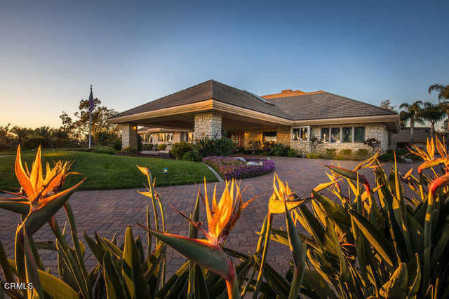 315 Vista Del Mar Avenue Camarillo, California This beautiful custom single story estate designed by renowned architect Bob Lee is truly a work of art. This home showcases a main residence with three generous sized bedrooms each with a full bath, cozy office and a detached 1 bedroom guest house and 8CAR. The contemporary design accentuates the spacious rooms with vaulted ceilings and enormous windows that bring the outdoors in. The open concept floor plan features a gourmet euro style kitchen with sleek white cabinetry, granite slab countertops, double Viking ovens, built in Sub Zero, a large walk in pantry and breakfast room that overlooks the backyard. Included is a butler's pantry additional storage with,heating lamp and wine refrigerator. The family room offers a stunning built in entertainment center and custom display cabinet, wet bar and beautiful vaulted wood ceiling that brings in an elegant touch. This home features state of the art smart features that can be controlled right from your smartphone. There is also whole house solar electricity and battery backup for both the main house and guest house in addition to also offering Life Source whole house/guest house water conditioning system. Enjoy dramatic sunsets from the formal dining room featuring coffered ceiling and large picture windows. The formal living room is highlighted by the sweeping distant views, soaring ceiling and large contemporary fireplace. The sumptuous master suite offers a large sitting area with a raised fireplace and commanding ocean views