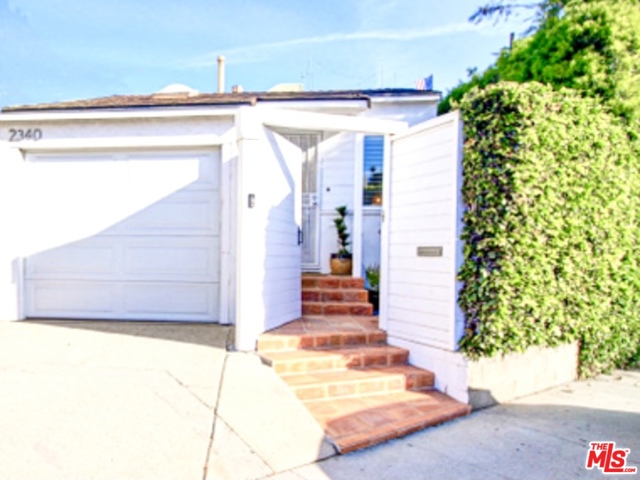 2340 Abbot Kinney Boulevard Venice, California Charming and adorable Venice Beach Bungalow single family home for sale. A prime location to live, work, and play. This fantastic private gated home is centrally located on Abbot Kinney and is walking distance to Venice beach, incredible dining, and retail stores where people visit from around the globe. It is a unique fusion of California bungalow style with a modern flair. The interior boasts hardwood floors, bright rooms, updated kitchen, bathroom, and hardwood floors throughout. French doors lead out to a private backyard oasis, perfect for sunshine entertaining or come inside on a chilly day to the living room and warm up with the cozy gas fireplace. Attached is a one car garage which can be used as an office, work space, or garage. This is a detached home with R3 zoning. Buyer to do their own due diligence for building potential. Come see what a rare opportunity this is to enjoy the vibrant Venice lifestyle filled with ocean breeze and relax in the sunshine.