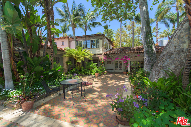566 E Channel Road Santa Monica, California This spectacular Spanish hacienda sits on six parcels nestled into the upper mesa of Santa Monica Canyon. The main house, the ''Mojica Hacienda'', was designed by John Byers in the 1920s and exemplifies Mission style architecture. Set behind graceful adobe walls and hand carved gates, a stone path winds through mature gardens to the main house. A two-story entry foyer opens to a vaulted beamed living room, adjoined by a formal dining room. A library with a fireplace & bar, a bedroom suite, two additional BRs and the kitchen complete the first floor. The second story has two additional ensuite bedrooms. Additionally there are three casitas, two studios, a theater and a chapel. The private, lush grounds are enhanced with a pool, outdoor bar & fireplace and a pickleball sports court.