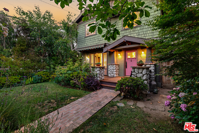 860 Nowita Place Venice, California Located on one of Venice's premier walk streets, this exceptional Craftsman infuses the perfect blend of original charm with modern refined updates. // What our Seller's love most: The inviting and cozy design, real wood/gas fireplaces, tranquil views, and the detached bonus/flex room is a perfect get-away space for work or guests. Also, the serene garden that blooms all year with wisteria, roses, blueberries, and a magnolia tree, filled with butterflies & hummingbirds. // What you'll love: The thoughtful details throughout including Ann Sacks tile, Kohler bathroom fixtures and "Tea for Two" cast iron tub, Currey & Company light fixtures, Johnathan Adler sconces in the two upstairs bedrooms, whole house water filtration system, outdoor shower, 6-foot cedar hot tub, & hidden surround sound speakers throughout. The spacious living room features a cozy fireplace, rich character detail built-ins, hardwood floors, and French doors opening to the front patio. The cook's kitchen includes a Sub-Zero refrigerator, vintage O'Keefe & Merritt double oven, ample storage, & breakfast nook. Upstairs, you'll find 2 bright & airy bedrooms and a large primary suite with vaulted wood ceiling, fireplace, and balcony. // Notable about the neighborhood: Walk Street movie nights in the summer, Firehouse pancake breakfasts, and Halloween is a whole-neighborhood blast.