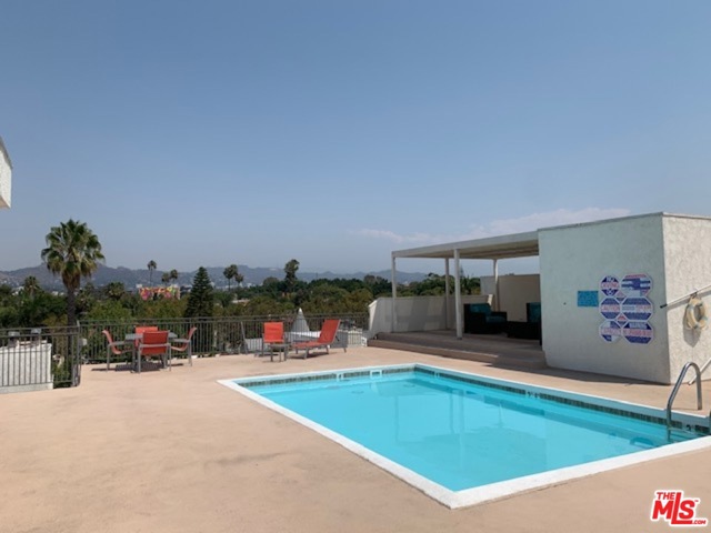 6151 Orange Street 221 Los Angeles, California Bright, south facing 2nd floor unit with a spacious balcony. Minutes to The Grove, LACMA, restaurants, and hip cafes. Rooftop pool with an amazing view of the Hollywood sign and hills. Secured parking for one vehicle.