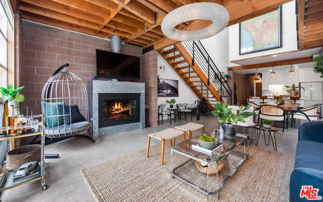 1124 5Th Avenue Venice, California A simply gorgeous NY style architectural loft located in the heart of Venice next to Abbot Kinney Blvd & just blocks away from the World Famous Venice Beach! Designed by noted architect William Adams AIA. This is a beautiful and light filled end unit looking with soaring curved ceilings and skylights looking out to the Santa Monica Mountains and over concrete floors that create a perfect open plan creative space. Two bedrooms on opposite sides of the second floor and a large private patio with a sliding door and a peek-a-boo view through to the always bustling and popular Abbott Kinney Blvd. This property comes with 2 assigned parking spaces and guest parking. This property is a blank canvas for any buyer to make their own!