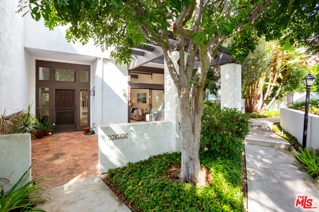 1656 Michael Lane Pacific Palisades, California Fantastic opportunity to purchase an end unit townhome in the prestigious Highland Villas. This spacious townhome features a formal entry, a large living room w/ a fireplace that opens to a beautiful patio that is perfect for outdoor entertainment. Further inside is a cozy den & kitchen with a breakfast bar. Upstairs are 2 bedroom suites including a master bedroom with a walk-in closet, fireplace and bath w/ dual sinks, a shower & soaking tub. Other amenities include a powder room, skylight, central heat & air, and peek a boo views of the surrounding mountains and a private two-car garage. This is a very comfortable unit but with some remodeling, it can be exceptional. The HOA includes Water, Earthquake Insurance, and wonderful a resort-style pool, spa, and gym. Truly a must-see.