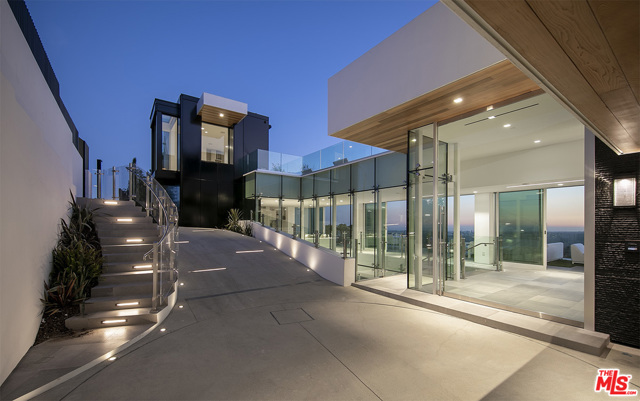 1615 BLUE JAY Way Los Angeles, California "Touch the Sky". Epic view modern compound on world-famous Blue Jay Way. Brand new 2020 construction. Approx. 11,500sqft with massive 3,000sqft pool deck and zero edge infinity pool. Walls of glass open to reveal panoramic jetliner views. Private gated driveway lead to glamorous arrival motor court. Beyond is a 3-story glass atrium in the style of an Apple store, wow on every level. Main entertaining level encompasses living room, dining room and a show kitchen designed by Dada complete with walk-in refrigerator and hidden catering kitchen. Grand Master suite with a closet to rival any major estate in the city. Additional living amenities include: wellness center with gym, juice bar and massage, screening room, commercial elevator, 2 offices and a total of 5 bedrooms. Architectural features include: Fleetwood doors throughout, closets by Molteni, Dornbracht fixtures and solid concrete construction. Years in the making... once in a generation opportunity.