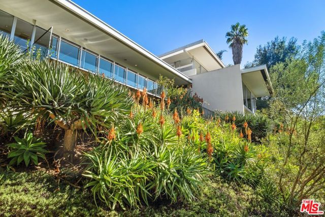 201 N Bentley Circle Los Angeles, California Welcome to one of Richard Neutra's magnificent achievements. This home is sited up a long private gated driveway on over half an acre with westward views reaching all the way to the Pacific Ocean. The home has been updated and expanded keeping with the Neutra's original plans. There are four bedrooms and five and one half bathrooms, a family room and a dining area off the living room, an open floor plan. The kitchen and living room to a large pool bathed with natural light from the impressive glass doors on both sides. There are two master bedrooms with head on views, a generous walk-in island closet, Terrazzo bath, sunken tub, steam shower and dual vanity that creates the artful space that Neutra envisioned. Maids quarters and laundry room off kitchen with a private entry, ample private parking complete this masterpiece of modernism.