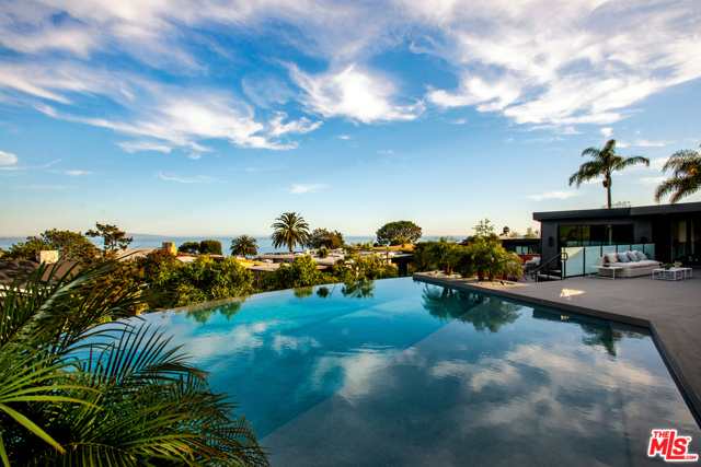 815 El Oro Lane Pacific Palisades, California Incredible Ocean View Modern Compound in the highly coveted neighborhood: The Knolls... This private newly constructed 8,230 SF contemporary sits on a 16,014 SF lot and consists of 6 bedrooms, 8 bathrooms, infinity pool, movie theater, and massive entertaining area featuring stunning ocean views of the Santa Monica Bay and Catalina Island. The open floor plan centering around the chefs kitchen with top end appliances, opens to the entertainment deck featuring outdoor kitchen, infinity pool, spa, sauna, steam room, changing room, and cold plunge. The master features incredible and sleek detail through the master bath and oversized closets. The downstairs levels feature the remaining 5 bedrooms, office, a game/living room, panic room, movie theatre and workout room. The house is fully automated with Crestron Automation, top of the line security system, and gated entry. Every design detail defines the exhilarating aspects this home has to offer for the most discerning buyer.