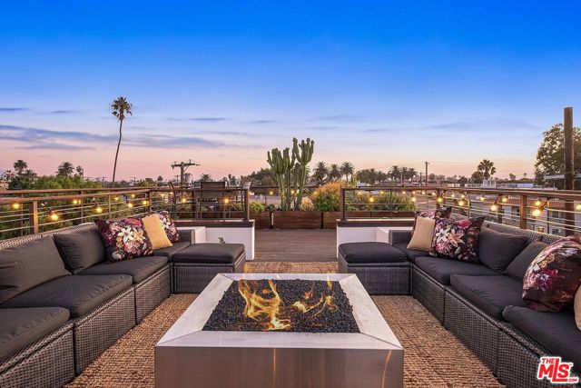 1220 Cabrillo Avenue Venice, California Exquisite Venice style w/ strong artistic pedigree, this sophisticated architectural is an idyllic hideaway. Perfectly situated on one of Venice's best streets, this furnished home offers a classy California beach life. Completely private & gated w/ lush greenery inside & out, there's an array of outdoor spaces for work & play under the sun. With walls of glass, the home's sky-high ceilings capture radiant light w/ a tone of serenity. Personality shines throughout w/ crafted designer details, luscious walnut millwork, & timeless finishes. An estate-like master commands the entire top floor w/ separate formal sitting area, expansive deck, and 15 ft vaulted glass ceiling w/ Velux skylights that open, giving a wow factor upon entry. Start & finish your days on the resort rooftop patio, ideal for entertaining year-round w/ 360 degree views from coastal area to the hills. *End of Summer rate of $14,995 for 1st month if lease is signed by October 15, 2020; rate of $22,500/mo thereafter.
