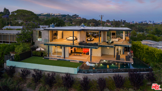 701 ROCHEDALE Way Los Angeles, California Astonishing 270 view of DTLA, Santa Monica coastline, and Crestwood Hills. This contemporary home is private yet boasts one of LA's best views on one of Brentwood's most architecturally significant streets. Photos don't do this view justice. This 5 bedroom home wows as the grand all-glass entry welcomes you into the expansive living room w/ jaw-dropping vistas. Stunning floor-to-ceiling, fully retractable sliding walls of glass create the quintessential SoCal living experience. The open floor plan includes a formal dining area & cook's kitchen w/ double isle & top of the line Thermador appliances. The master includes a fireplace, 2 large walk-in closets & en suite bathroom w/ spa tub, double sinks, & luxury imported double shower. Downstairs is an entertainer's dream w/ a family room that flows into the home's yard, infinity pool & spacious deck w/ fire pit & floating BBQ. A full-service home theater, private office, gym, separate guest suite & an audio room complete this luxury home.