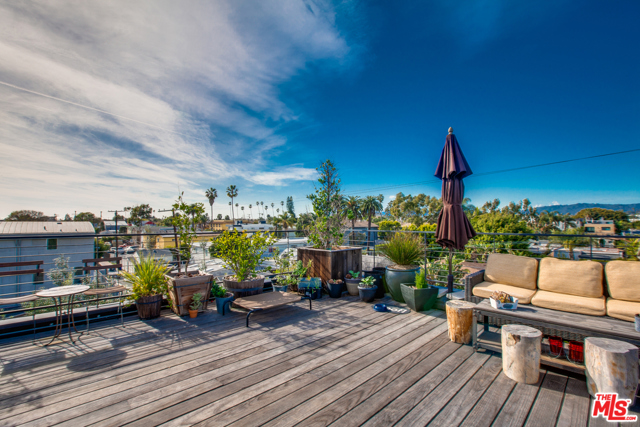 663 Brooks Avenue Venice, California TRIBECA COMES TO VENICE! This spectacular 3 bed/ 3 bath loft style home boasts a funky magnificence unlike any other Venice space. With exceptional living areas, centered around a 1400 sqft Great Room, with soaring 15 ft high ceilings and mahogany floors ,leading into the gourmet kitchen, with 400 bottle wine storage. This is a truly amazing entertaining space. The lower level comprises of 2 bedrooms and a study, while the master suite is on the top floor and has a Euro-style bathroom with a 2 person Jacuzzi. The huge roof terrace with fire pit, barbecue and lots of greenery is great for al fresco entertaining and enjoying the sea breezes and views. The property is back off the street and very quietly situated, finally there is parking for 2 cars. A fabulously appointed, very private property in great Venice location.
