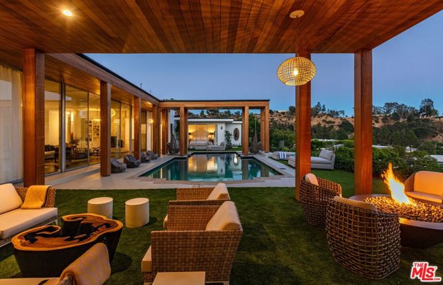 1860 Carla Beverly Hills, California This mid-century modern oasis is your once in a lifetime opportunity to live in the most sought after location in all of Beverly Hills, the one and only Trousdale Estates. Explosive jetliner views from DTLA to Beverly Hills, Century City to the Pacific Ocean and sunset views of the Getty. A seamless indoor/outdoor floor plan includes large oversized master suite with a fireplace, lounge area and dual master baths & closets. This one-of-a-kind entertainer's paradise features a large patio and outdoor lounge area with fire pit, pool, BBQ, bar and an oversized motor court with room for 10 cars. Live the life you've always dreamed of in the most prestigious zip code in the world.