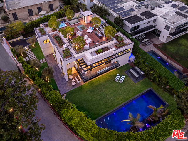 1100 La Collina Drive Beverly Hills, California Magnificent gated new architectural situated on the only private and gated street with just 14 homes. Minutes to the Beverly Hills Hotel and to the Sunset Strip on the exclusive enclave of La Collina. Designed for the owner with every amenity and utterly extraordinary quality, design and detail. Fabulous open floorplan with kitchen, dining and living all open to the pool and yard. Lower level entertainment room and bar with luxury theater seating for 30 people, Far Infrared sauna and steam, massage room, salon. Rooftop deck with city light/treetop views and second hot tub with full kitchen and over 2,000 sq ft of deck space and full vegetable gardens. Stunning master suite with 3 additional suites upstairs, 1 suite on mid floor and 1 additional suites on lower floor. 6 car garage (3 lifts) and 6 car parking. Glass elevator to 3 floors, surround sound, smart home/Control 4. Paradise every day on the only private gated street in The Triangle.