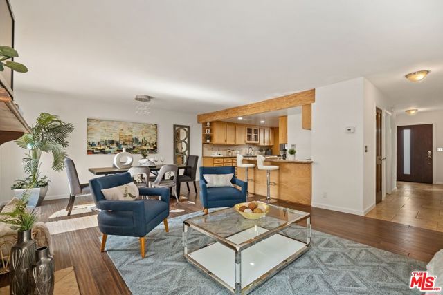 1118 17th Street 4 Santa Monica, California Spacious 3-bedroom 2.5 bath + loft townhome with a private roof-top deck in the coveted Franklin School district. This south and north facing unit has an inviting stone entry that flows to an over-sized living room with high ceilings and a stacked stone gas fireplace. Two sets of French doors let in an abundance of light and lead to a generous south facing patio equipped with electricity, water, and gas making BBQing and outdoor entertaining a breeze. Remodeled kitchen with considerable cabinet and counter space looks out to dining area and living room. Dry bar off kitchen was built in 2014 with two wine fridges and overlooks the living room. Side-by-side laundry in closet and remodeled powder room complete the first floor. All three bedrooms up. Primary suite with sky-high ceilings and wonderful loft with French doors opening to a private south facing roof-top deck with glorious city views. Loft has extra-large closet/storage room. Remodeled primary bath has an epic rainfall shower with two sets of wall jets and separate soaking tub. Two good-sized bedrooms and remodeled bath are also up. All closets are professionally organized, and built-in cabinets throughout provide a vast amount of storage. More storage space in the private, 2-car garage with direct entry. Fantastic townhome located in a small, five unit building North of Wilshire. Close to shops and restaurants on Montana Avenue and Wilshire Blvd. HOA dues include earthquake insurance.