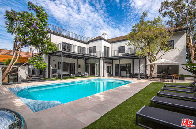 10401 Wyton Drive Los Angeles, California ACROSS FROM HOLMBY PARK sits this beautifully remodeled compound combining character & contemporary design. Perched on a half-acre knoll in prime Little Holmby & nestled amongst lush landscaping, this California estate boasts 8 beds/10 baths & an abundance of natural light throughout. Gated with 10-car parking, circular motor court, service entrance, modern kitchen & a large primary with separate his/hers bathrooms & closets. Generously appointed interiors include a striking entry foyer with pivot door & skylight, living room with porcelain fireplace, along with a media/family room with peaked wood ceilings & bar, 4 fireplaces, large guest quarters with kitchenette & a gym/office - which all walkout to the pool area. The outdoors are a tranquil oasis with multiple entertainment areas & an expansive rooftop deck with enchanting city views. Close to Westwood & Warner Avenue School, one of the highest rated schools in LA, as well as a short drive from Century City & Beverly Hills.