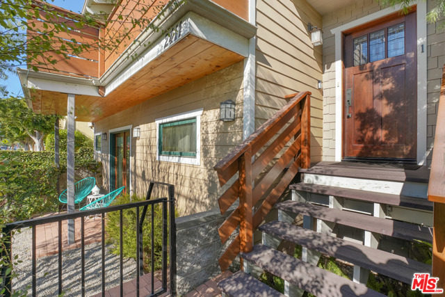 2411 4Th Street 1 Santa Monica, California Experience Santa Monica beach living. Perched on top of Ocean Park's 4th street hill, this rare west, front-facing, three-level townhome is a one of a kind craftsman with ocean views. Just a few blocks from the beach. This home receives an abundance of sunny, natural, coastal light year-round. The living room features a combination of cathedral and beam ceilings with multiple skylights. The master bedroom is complete with a cozy fireplace and private patio, walk-in closet, an en suite master bath with double sinks, a spa tub, and a separate shower stall, all complemented by a striking mixture of granite, marble, and travertine. The second bedroom also with an en suite bathroom and walk-in closet, has French doors opening onto a private front garden. The large kitchen includes stainless steel appliances. Hardwood floors throughout the property. Direct access to a private two-car garage with storage. Just down the street from several Main Street shops and dining establishments.