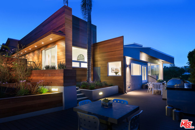 654 Erskine Drive Pacific Palisades, California Overlooking verdant Temescal Canyon with a peak a boo view of the blue Pacific, this home is situated behind a secure private electric gate. This architectural estate features oversized rooms, soaring ceilings, great room which seamlessly joins with the gourmet kitchen, living room, and step down dining room. The home is flooded with light in the main house which also features a a private office , study and 4 ensuite bedrooms in the main house. Also attached is a guest suite and bath which can serve as a mother in law suite, exercise/yoga retreat or whatever you want to imagine. 3 car garage and plenty of parking behind the gates. A true retreat.