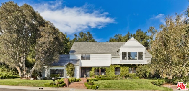 17798 Camino De Yatasto Pacific Palisades, California Offers due Nov 12. Set at the end of a flat cul-de-sac, this classic East Coast Trad in the 24-hr guard-gated Palisades Country Estates. This well-designed home offers 4-bdrms, 3-baths + a bonus suite off the garage (ideal office, Zoom-room or guest suite). Large liv rm with vaulted wd beam ceiling & a massive frplc opens to beautiful patio space that extends the indoors. Spacious din rm off updated kit/great rm with walk-in pantry & custom built-ins. The main level is completed by one bdrm, one bath & laundry rm. Upstairs boasts a grand primary suite incl a sitting area, dual walk-in closets, and a lrg spa-inspired bath. The upper level also enjoys two additional bedrooms w/generous closet space plus shared hall bath. French drs off the kit/brkfst lead to a serene brick patio & grass area surrounded by nature and offering complete privacy. Pub rec shows 3,230sqft. Recent measurement = 3,525sqft (incl extra rm/bath off garage). Buyer to verify sq ft, permits, etc.