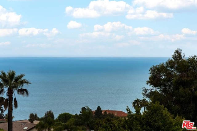 275 Monte Grigio Drive Pacific Palisades, California Ocean Views, Beach Access, Fabulous Shopping & Dining, The Palisades Village, and The Getty Villa all surround you here in the Castellammare neighborhood of the Pacific Palisades! Catch the Sunset from the Great Room, or make it cozy by the wood-burning fireplaces. Banks of sliding doors open to the large 40 x 6 balcony with huge Ocean and Mountain Views. All in the same wing are 4 well-appointed bedrooms. The primary suite, includes a private wrap-around balcony, and a bathroom with his and her sinks, a separate shower, and a soaking tub. The downstairs Family Room is very spacious, has a projector perfect for movie nights, and opens to the grassy backyard. The backyard has a built-in BBQ and firepit, as well. On the side yard are two large garden boxes with plenty of room for growing your own veggies and herbs. This property is at the end of the street with no neighbors on the east and the Getty Villa to the north, creating distinct privacy and the tranquil feeling of being by the ocean and the mountains. Get to the beach in minutes by crossing the PCH pedestrian bridge from the neighborhood directly onto the sand. Also minutes to Los Liones Trailhead, Lake Shrine, Bel Air Bay Club, Gladstones, Temescal Canyon, Gelsons, and more. This is the Dream Pacific Palisades Lifestyle!