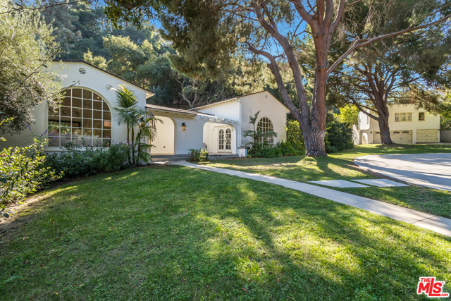 2653 N Vermont Avenue Los Angeles, California As natural light peaks through the mature, organic Los Feliz forestry & trickles into the contemporary California Ranch Estate, it is hard not to feel at home. Through a Spanish front-door sits the white washed, single-story charmer & guest house on an oversized -acre lot. Two beautiful great rooms w/ high, wood-beamed ceilings, a massive sun-lit chefs kitchen, a formal dining room, breakfast nook & a stunning office highlight the 4 beds & 4.5 baths. Looking out through the numerous French windows & doors onto the vast acreage, bask in the serenity of a completely private compound w/ only one neighbor to the south & backed up by Griffith Park, or take a dip in the custom-built, one-of-a-kind pool, waterfall & spa. With a motor court accommodating 13 cars as well as a three-car garage, there is plenty of space for hosting guests. Offered only three times in the last six decades, owning this estate is as rare as it gets.