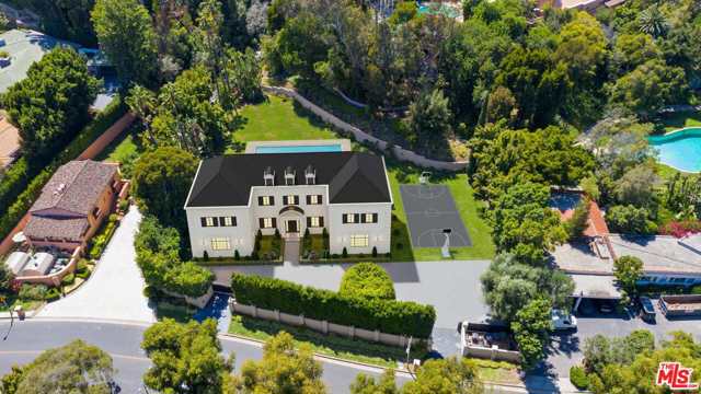 1013 N Beverly Drive Beverly Hills, California Private & gated Mediterranean Estate on over 39,000 sq ft of land. Prime Beverly Hills location, moments to Rodeo Drive and The Beverly Hills Hotel. Featuring 6 bedrooms and 8 baths, the compound includes a large motor court, vast lawns and large pool. Great sense of space and privacy with the ability to expand the existing residence or build new. Two privacy gates with lots of parking. The estate can be combined with "The Beverly House" for a total of 4.4 acres, this property provides a once in a lifetime opportunity.