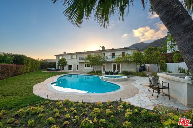 380 SURFVIEW Drive Pacific Palisades, California Discover the ultimate Mediterranean Masterpiece w/incredible ocean, mountain and city views from almost every room! Tucked away in the prestigious Pacific View Estates, this beautifully remodeled abode features floor-to-ceiling windows and sliding doors that bring the outdoors in for quintessential coastal living at its very finest. Interior features include vaulted ceilings, imported stone flooring and natural lighting throughout, full chefs kitchen with top-of-the-line appliances, exquisite Master w/sizable bath boasting dual shower and oversized soaking tub. Additional hallmarks include spacious living quarters w/well-appointed baths, generously sized closets and ample storage space throughout. Perfect for entertaining, this tropical oasis boasts ample outdoor living space where you can take in the sweeping sights by the pool, relax by the jacuzzi or even fire up the grill for a night of dining alfresco under the iconic southern California skyline. Act fast, this treasure wont last!