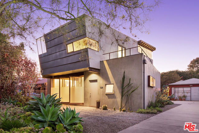 1337 Palms Boulevard Venice, California Warren W. Wagner, W3 Architects | McRight/Wagner Home and Studios, 2001. Here on the quiet side of Venice, close to the ocean yet far from urban distractions, this unique creative compound provides an intimate setting for living and working in harmony with nature. The large quarter-acre lot generously accommodates two separate structures seamlessly connected to the mature drought-tolerant landscape, with fire pit, outdoor dining, and ample room for pool and future additions. Facing the street, the award-winning studio houses the architects office downstairs and artists workshop up, noteworthy for both architectural integrity and innovative sustainable technologies, features too often mutually exclusive. Thick block walls and polished concrete floors are visually compelling but also capitalize on the suns energy to heat and cool the home, and a passive solar water system integrates in-floor radiant heat. Similarly, a series of large custom steel doors provides a dramatic faade element, but also direct on-shore breezes into the home for passive ventilation. The result is a cohesive architectural statement in the sculptural school of Southern California, with exposed structural steel and glued laminated timber, also sensitive to the environment. In back, the original 1962 bungalow has been opened and expanded, with raised ceilings, large skylights, exposed wood framing, and French doors opening to an outdoor deck and spa. Together the two homes function as a unified system, with separate spaces for living and working at opposite ends of the lot, with plenty of room for recreating in between a necessity in todays complicated world. Front: 2 BD, 1 BA, 2,200 SF. Back: 2 BD, 1 BA, 1,076 SF. 10,894 SF Lot.