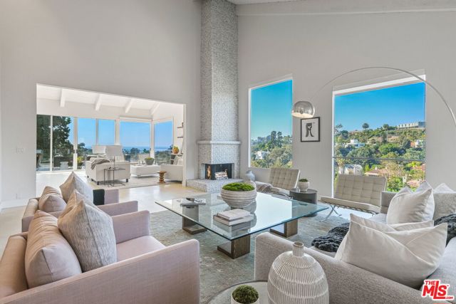 519 Stassi Lane Santa Monica, California The finest ocean & canyon views of any home on Stassi lane. Breathtaking ocean & canyon views from this gorgeous, modern home. Open floorplan with vaulted ceilings, hardwood floors & walls of glass with stunning views of the Pacific Ocean & Santa Monica Canyon from every level. 5 bdrm, 4 bath plus a newly added, private entrance lower level (2 rms + bath) provide 4,300+ sqft of versatile living space. Lower level would make an amazing home office & gym or guest suite with own patio. Lovely outdoor space with flat yard, terraced hillside garden, BBQ area & sunny entertaining deck- all with expansive views. Excellent layout with 4 bdrms upstairs plus an additional den/flex space. On the rim of beautiful Santa Monica Canyon, short distance from the famous Santa Monica Stairs exercise area, award-winning Canyon Charter School, Rustic Canyon Rec Center, trendy canyon restaurants & of course, the beach!