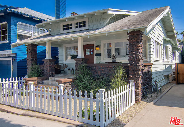 156 Fraser Avenue Santa Monica, California A wonderful and rare opportunity to own this one-of-a kind two-unit beach property in Santa Monica's historic seaside community of Ocean Park. Fraser is one of 5 tree lined streets dotted with a mix of beautifully preserved colorful cottages and bungalows that have been in demand since the lots were first sold in 1901. This coveted neighborhood is steeped in history and elegance and this is the chance to make it your own. The 2BD/2BA craftsman front house combines vintage details with updated and fresh beach appeal featuring classic custom built-ins, coffered ceilings and handcrafted wall ledges throughout. In the front house enjoy great flow from the living room to a formal dining room and updated kitchen. Both bedrooms feature en-suite baths, one with a jetted tub. The charming front porch with ocean views is perfect for dining alfresco and relaxing on long summer nights. The delightful 1BD/1BA rear unit enjoys its own private deck, galley kitchen, separate address, utility and laundry hook ups. Ideal for live/work, guests, income or investment. And if your vision for this home is otherwise, completing the offering are city approved plans to build an exceptional custom designed 4 bedroom two-story home with an ADU and quaint rear yard. Watch the sunsets, enjoy the nearby parks and beaches or the shopping, dining and nightlife just a few blocks away.