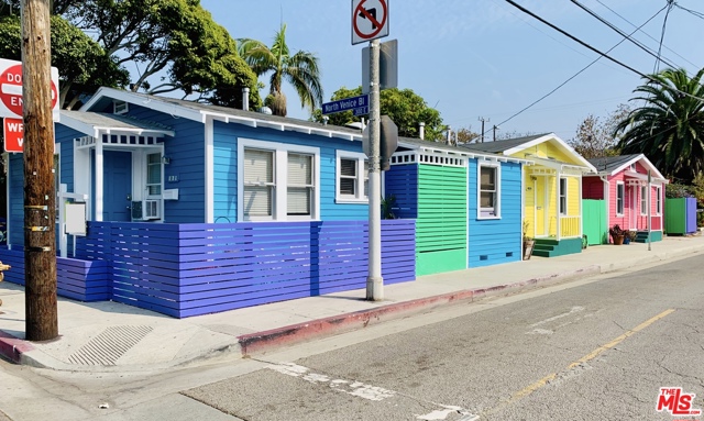 402 N Venice Boulevard Venice, California This 3-unit investment opportunity delivers annual income $120,600 and CAP rate of 5.6 on the always-in-demand beach lifestyle! Tenants are drawn in by ocean breezes, sunny skies, and a location thats just blocks from the Venice Boardwalk, canals, and shops & dining at Abbot Kinney & Main St. An exterior clad in bright Caribbean-inspired colors stands out as fun & playful, putting these charming bungalows on the map. Vintage details are found throughout each unit, with wood floors, solid shaker doors, classic hardware, built-in cabinets & cozy fireplaces. Practical upgrades such as recently updated bathrooms and laundry in each unit are tenant must-haves. Unit A features 2 beds/ 2 baths, deeply hued vaulted ceilings, a kitchen with SS counters, & rustic barn door in the master bedroom. Unit B offers 1 bed/1 bath, with windows bringing in flowing light. Vaulted ceilings & fireplace trimmed in wood are stand-out elements, and the kitchen looks out on a private deck. Unit C is 1 bed/ 1 bath, with a bar counter creating a great hang-out spot that connects the living room, kitchen & dining nook. A bonus mud room opens to a private outdoor space with gorgeous bougainvillea. The bathroom is a pass-through that connects to the bedroom and laundry. Contact us today for a list of recent upgrades, and detailed income information. Showings only with excepted offer