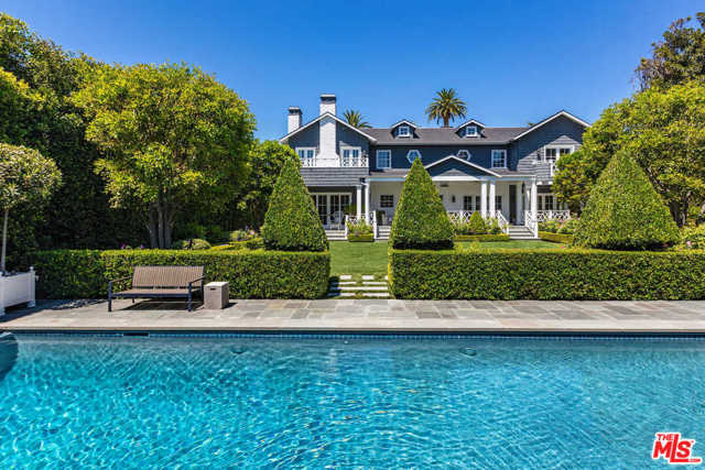 326 S Windsor Boulevard Los Angeles, California Situated in the historic Hancock Park/Windsor Square neighborhood, this iconic Nantucket-inspired estate offers approx. 8,058 sq ft of living space, surrounded by leafy hedges and exquisite landscaping. Recently reconstructed, the residence masterfully blends traditional architecture and crisp, modern design, with detailed craftsmanship including crown moldings, intricate paneling & marble floors. The 1st floor features formal living & dining rooms, a library, chefs kitchen & adjacent family room. 5 bedrooms include the exceptional primary with sitting room, spa-style bath and 2 walk-in dressing rooms. Additional rooms include a den, office, gym and 13-seat theater. French doors open to shaded terraces, expansive lawn and heated pool/spa. A detached guest house with kitchen and viewing terrace over the pool sits above the 2-car garage. While offering absolute privacy and serenity, the estate is located moments from Larchmont world-class dining, shopping and entertainment.