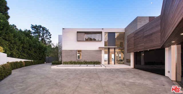 1401 Londonderry Place Los Angeles, California Capturing sweeping views of the L.A. city lights, this new modern architectural is tucked among the trees on an ultra-private promontory above the Sunset Strip. Envisioned by architect George Kurczyn the residence embodies Californias indoor-outdoor lifestyle while featuring a thoughtful blend of intimate areas and voluminous entertaining spaces. Enter the gated, tree-lined drive to the soaring 2-story entry and spectacular living/dining areas, where Fleetwood doors reveal the views and open to the infinity-edged pool. The primary suite boasts a sitting area with fireplace, private balcony, dual dressing rooms and spa-style baths. Features include a family room, office, library, show kitchen with Miele appliances, catering kitchen, 12-seat theater with 20 screen, a 1,2000-bottle collectors wine cellar, gym, 3-story elevator, Crestron automation and 4-car garage. The 11,300-sq-ft home offers the utmost peace and quiet, moments from the citys best dining, shopping and entertainment.