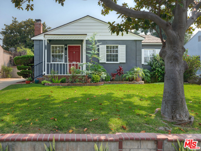 6532 W 81St Street Los Angeles, California Folded into the Kentwood area of Westchesters most picturesque neighborhood, this lovely three-bedroom traditional bungalow with Cape Cod feel will delight you at every turn. Featuring large spaces for the family to gather as well as private rooms for working or schooling at home, this darling home is ideal for comfortable living. Host festive parties in the expansive multi-purpose backyard with detached garage, covered patio, ample grass, and play structure or settle into the bright and airy living room to enjoy hardwood floors, woodburning fireplace with decorative mantle, crown molding, and windows that never end. Cook up memorable holiday meals in the charming updated kitchen accented with cute doggy door, cottage cabinets, granite countertops and back splash. Close the wooden shutters in the impressive master bedroom with farm door and enjoy the double sink vanity, glass shower, and decorative tile work as you wind down in one enchanting home.