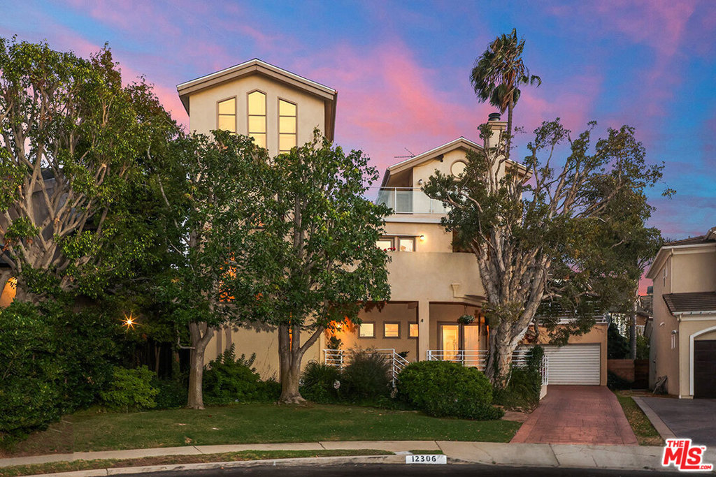 SOLD: 12306 Clover Avenue Los Angeles, California Located in a cul de sac on Mar Vista hill, this extensively rebuilt & remodeled contemporary home is infused with light through architectural windows & french doors. The eat-in cook's kitchen featuring granite countertops & stainless steel appliances, opens to the family room & lush private garden. The master BR suite is a serene retreat with high ceilings, a loft opening to one of the rooftop decks, walk-in closets, and a newly remodeled bath with dual sinks, sep. tub/shower. The living room with FP & french doors flows to the formal dining room, perfect for holiday dinners, or entertaining friends. Detached 2 car garage with rooftop deck. Cooled by ocean breezes with views of the Santa Monica mountains, city lights, & the ocean from decks. Convenient westside location.