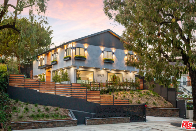 16723 W Sunset Boulevard Pacific Palisades, California Majestically elevated amongst tall trees & privately set back above the road you will find this special residential experience - lovingly called The Sunset Tree House. Taken down to the framing, then artfully reimagined and painstakingly modernized, then upgraded & completed in 2021 by the owner - a prolific design expert (in her own right), this home is a rare offering indeed. This soaring Modern-Farmhouse styled getaway boasts an open floorplan w/vaulted sky-lit ceilings, state of the art architectural elements and an eat-in kitchen designed by renown Italian kitchen designer EFFETI, offering the highest quality appointments including Gaggenau appliances, lacquered cabinets and hardware by Blum of Germany and Calacatta-Nuvo stone counter tops by DiGroup of Beverly Hills. An inviting backyard kitchen & 2 well appointed master suites, each with unique & tastefully designed bathrooms complete this beautiful home, which offers a level of sophistication rarely seen in this price range.