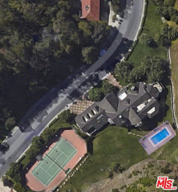1323 Moraga Drive Los Angeles, California One of largest lots in Bel Air: Nine acres, with at least three flat. 9500 square foot home with 5 bedrooms plus maids room, 5 baths, 4 car garage, north-south tennis court and basketball court with night lighting, and 60 foot pool with electric cover kept at 90 degrees. Behind 24/7 guarded gates on quiet cul de sac in Moraga Estates, so no tourists. Magnificently built home, with marble, wood paneling, endless windows, and magic lighting effects. Backs up against Santa Monica National Park, so it is like living in quiet secluded natural park. This site includes virtual tour.
