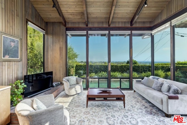 878 Oreo Place Pacific Palisades, California First time on the market in 25 yrs, this is a special property set on a small cul-de-sac north of Sunset Blvd. Exceptional views from the front AND back of the house. An architectural style 1940s home set above the street w/a magical & welcoming courtyard garden. Enter into a bright & charming liv & din rms, plus two bdrms w/shared hall bath. The heart of the home is the kit/fam rm w/dramatic ceiling, floor-to-ceiling windows, classic wood & tile detailing and panoramic views of the city/ocean. The upper level boasts a generous flex rm (sitting area, office, etc) as well as the primary suite which enjoys spectacular views of both hillside/mtns & city/ocean. Private yrd features a pebble-style pool/spa + a nicely-done deck. 24hr notice required. Prior to confirming showings, we must receive both PEAD and either pre-approval or pre-qual letter stating lender has received & reviewed buyer's credit, financials & income. Patio set may be included. Tract 9300 & Coastal Commission apply.