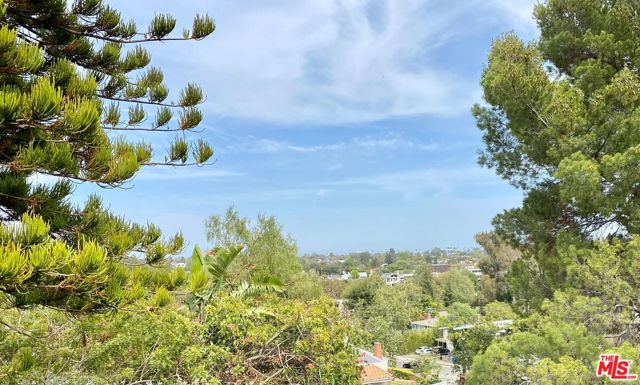 16550 Chattanooga Place Pacific Palisades, California First time on market in 56 years - Trust sale - Mid-century major fixer or opportunity to build new on an approximately 10,000 square foot terraced gentle downslope lot. Three bedrooms, two bathrooms with most living areas located on the street level. Expansive tree-top and village views. Mature trees and bamboo create a lovely ambiance and sense of privacy. Desirable location near village schools, shops and services.