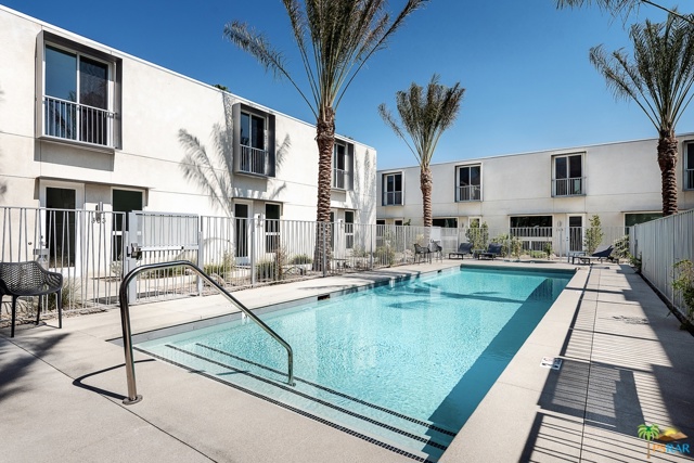 2150 N Zanjero Road Palm Springs, California Welcome to Palm 2150, an exclusive community of 17 Bauhaus-inspired townhomes newly constructed and designed by the acclaimed Booth Hansen Architects. Located in an inviting neighborhood setting on Zanjero Road, Palm 2150 offers a classic Palm Springs indoor/outdoor living environment and mountain views at their very best. Each residence overlooks the lushly landscaped palm-lined courtyard that complements the modern, new exterior style of the townhomes. The courtyard features a 45-foot swimming pool and spa, lounge area and common garden a perfect, private sanctuary for relaxed enjoyment. Inside, Palm 2150 offers four, two-story floor plans, ranging from 1,300 to 2,110 square feet all designed with an open space concept, blending kitchen, dining and living areas together and featuring large windows, glass doors and private yards. Interior finishes such as polished concrete, linear electric fireplaces, quartz countertops, stainless steel appliances and frameless contemporary cabinetry.
