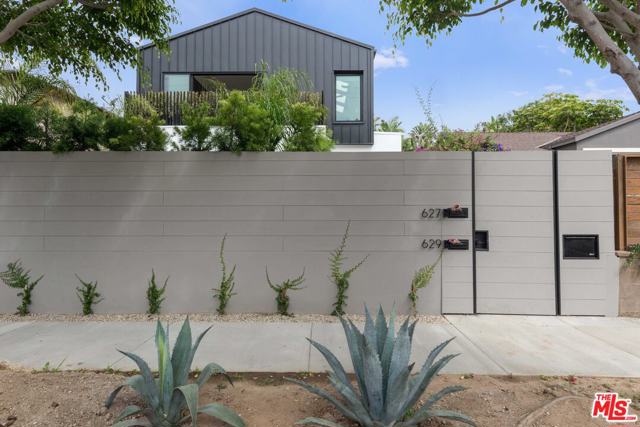 629 Sunset Avenue Venice, California Constructed from the ground up in 2020, this dazzling modern-architectural gem in the heart of Venice will blow you away. Nestled safely between Rose and Abbot Kinney, complete with privacy walls, this back unit duplex comes with 4 bedrooms, 4.5 baths, and over 2,600sf of stylish luxury. No detail was overlooked with this gorgeous three-level home. Upon entering through the oversized wooden door, you are greeted with two ensuite bedrooms and separate laundry room. Up the steps is the main level with kitchen, powder room, two ensuite bedrooms, including the master suite with dual walk-in closets, double vanity, seated shower, and soaking tub with built-in TV. The sleek chefs kitchen with imported Miele appliances and enormous marble waterfall island overlook the breakfast bar and family room with skylights and vaulted ceiling. Other details include wide plank hardwood floors, dual-zone Nest climate system, Fleetwood doors, and surround sound. Sip on sunset cocktails while lounging around the cozy fire pit on top of the massive rooftop deck with big 360 degree views of Venice. This entertainer's dream is available September 15!