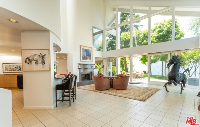 16826 Monte Hermoso Drive Pacific Palisades, California Amazing Architectural home w/ soaring high ceilings, wide open floor plan & enormous volume of space, making this impressive 5,724 SF home one of the best valued on the market. Main rooms & entire backyard (with room for pool) boast incredible unobstructed canyon & mountain views w/ dramatic sunsets. Located on a quiet cul-de-sac w/ impressive estate sized neighboring homes. Ideally located a short distance to the Village, beach, surf, hiking & biking trails, great schools & PCH; 1 block from Palisades Hills Recreation Center w/ tennis courts, pool & community room. Ideal room sizes with ample wall space. Large living, dining & massive family room/game room. Great for indoor/outdoor entertaining. Grassy backyard w/ room to expand. Spacious master suite w/ large terrace, canyon views, fireplace, spacious bath & walk-in closet.
