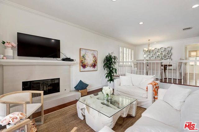 128 GEORGINA Avenue 4 Santa Monica, California Beautifully updated townhome sited on one of the most desired streets in Santa Monica. This 2 bedroom plus loft and 2 ½ bath unit is just one block from Ocean Avenue and Palisades Park and is located in a secure boutique complex of only 10 units. It is light and bright with high ceilings, French doors, and peek-a-boo views of the ocean from the top floor! The main floor living, dining, and kitchen are perfect for gracious entertaining. Each bedroom has a spacious ensuite bathroom. The master suite has high vaulted ceilings, a loft, and an additional multi-use space ideal for an office or gym. Additional amenities include side by side laundry in the unit, a private and oversized 2+ car garage with direct access to the home and an elevator that services each level, from the garage to the loft space.