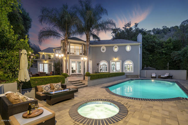 1357 Schuyler Road Beverly Hills, California This classic Beverly Crest estate, located just minutes north of Sunset Blvd in the renown upper flats of Beverly Hills, was completely rebuilt in 2011. Private and gated, this light-filled home features a sweeping marble staircase, reminiscent of the bygone Hollywood era and the estate's original owner, Errol Flynn. The home has a grand formal living room with French windows and doors, a large home office, a private lounge area with pocket French doors, and a spacious modern gourmet kitchen with newer high-end appliances, expansive crystal quartz center island, Sub Zero refrigerator, and a built-in Miele coffee station. The kitchen opens to a large family room, as well as the formal dining room. Adjacent to the kitchen is a maid's room with a full bathroom and laundry room. The upper level features a luxurious master bedroom suite with balcony, spacious his-and-hers dressing rooms with bathrooms, a separate steam shower, plus 3 large additional bedrooms (2 with ensuite baths and walk-in closets), and a 300 SF sundeck. The home's serene backyard features a salt-water pool & spa, built-in BBQ with sink and refrigerator, gas fire pit, retractable patio shade, outdoor heaters and sophisticated landscaping which lends complete privacy. Additional amenities include a separate workshop, gated driveway, 9-camera security system, backup power generator, 2 tankless water heaters, detached 2-car garage with built-in storage, upstairs bonus room and bathroom.