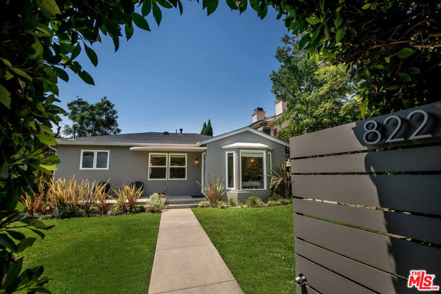 822 26Th Street Santa Monica, California Spectacular redesigned single story California Bungalow North of Montana Ave in prime coveted Santa Monica. House exterior features mature hedge w/ front gate for privacy. Property includes detached 2 car garage & oversized upgraded detached guest house w/ full bath, storage closet & laundry hookups, perfect for home office & gym. Entry opens to spacious living room w/ decorative fireplace & adjacent dining room. Chefs kitchen includes Viking range/oven, SS appliances, custom cabinetry & large island w/ bar seating. Spacious sun filled Den includes custom built-in entertainment center & opens to private patio for indoor/outdoor entertaining + al fresco dining. Master suite features pitched soaring ceiling, walk-in closet, dual vanity sinks, soaking tub, & steam shower. All bedrooms w/ ensuite bathrooms. Hardwood floors & central A/C. Main home has washer/dryer hookups. Lush backyard w/ manicured lawn hedged for privacy. Santa Monica-Malibu Unified School district. Minutes to the ocean!