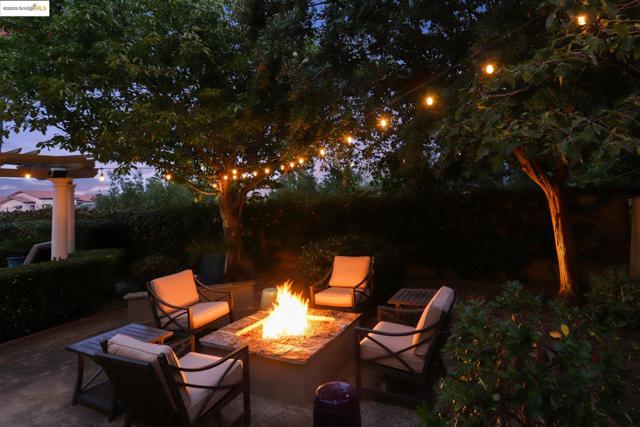 View of patio featuring an outdoor fire pit