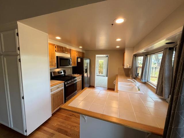 view from family room through kitchen towards dining area 
