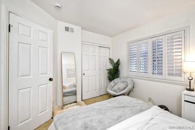 Bright bedroom with custom shutters.