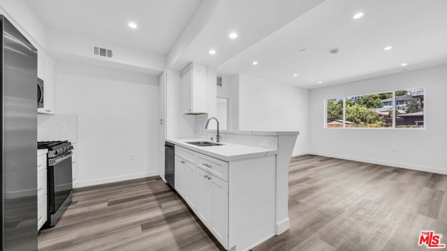 627 N Dillon Street, Los Angeles CA: https://media.crmls.org/mediaz/a15f15a6-e38a-492b-ad48-b3964a8fb1a7.jpg