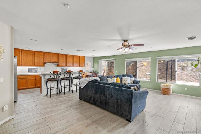 Kitchen over looks the family room so everyone can all be together! This is where the family gathers right?